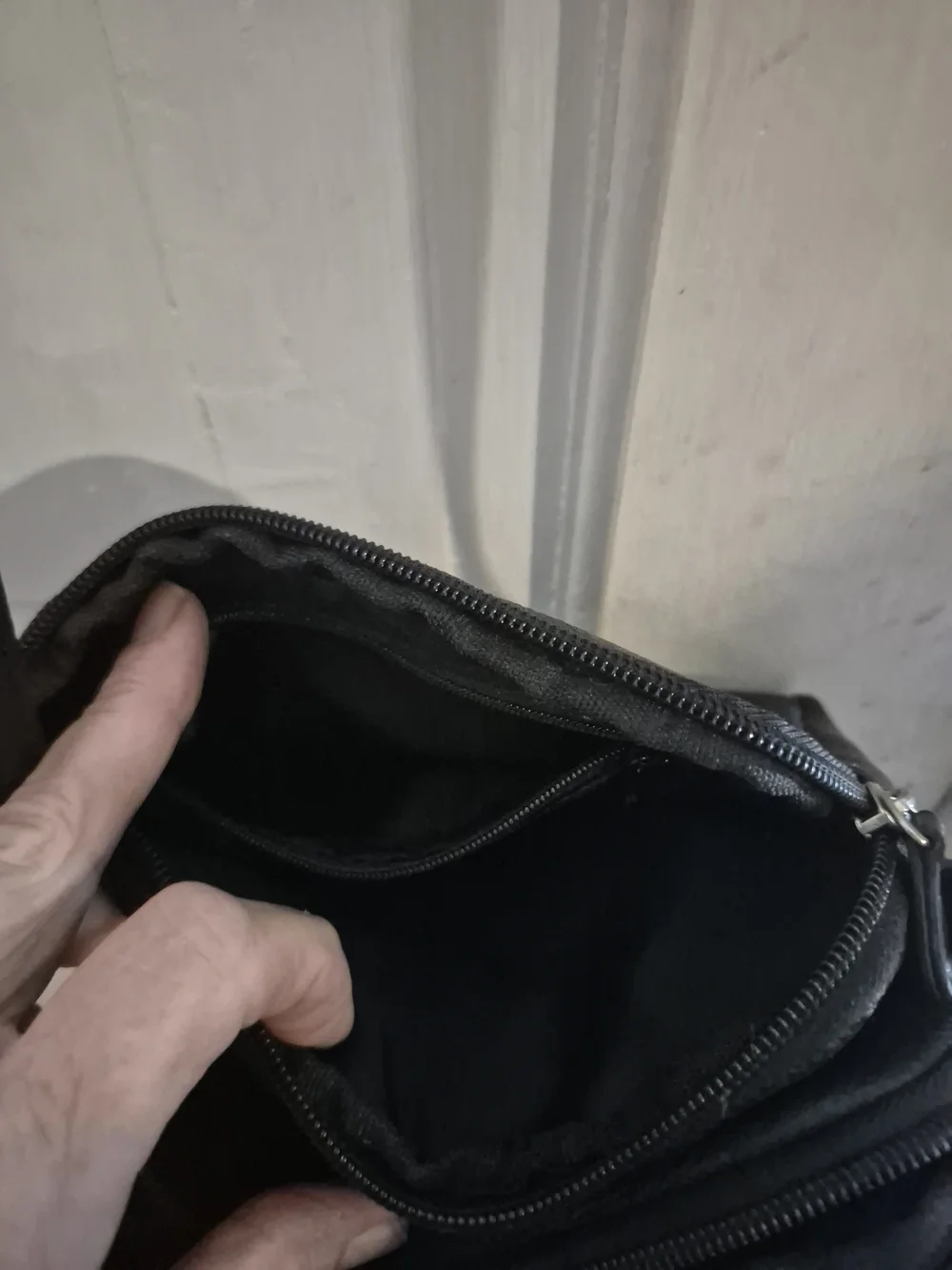 MultiSac Black Leather Crossbody Bag - Polished Logo Accent